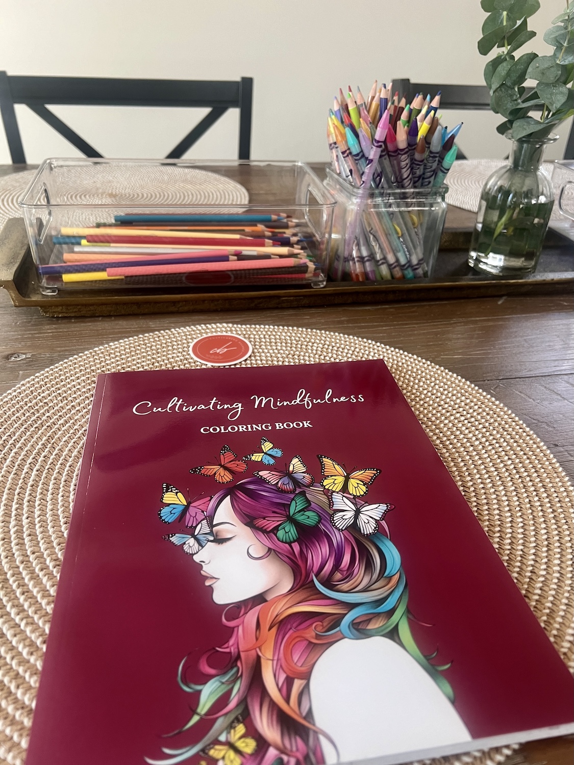 coloring book and pencils on a table