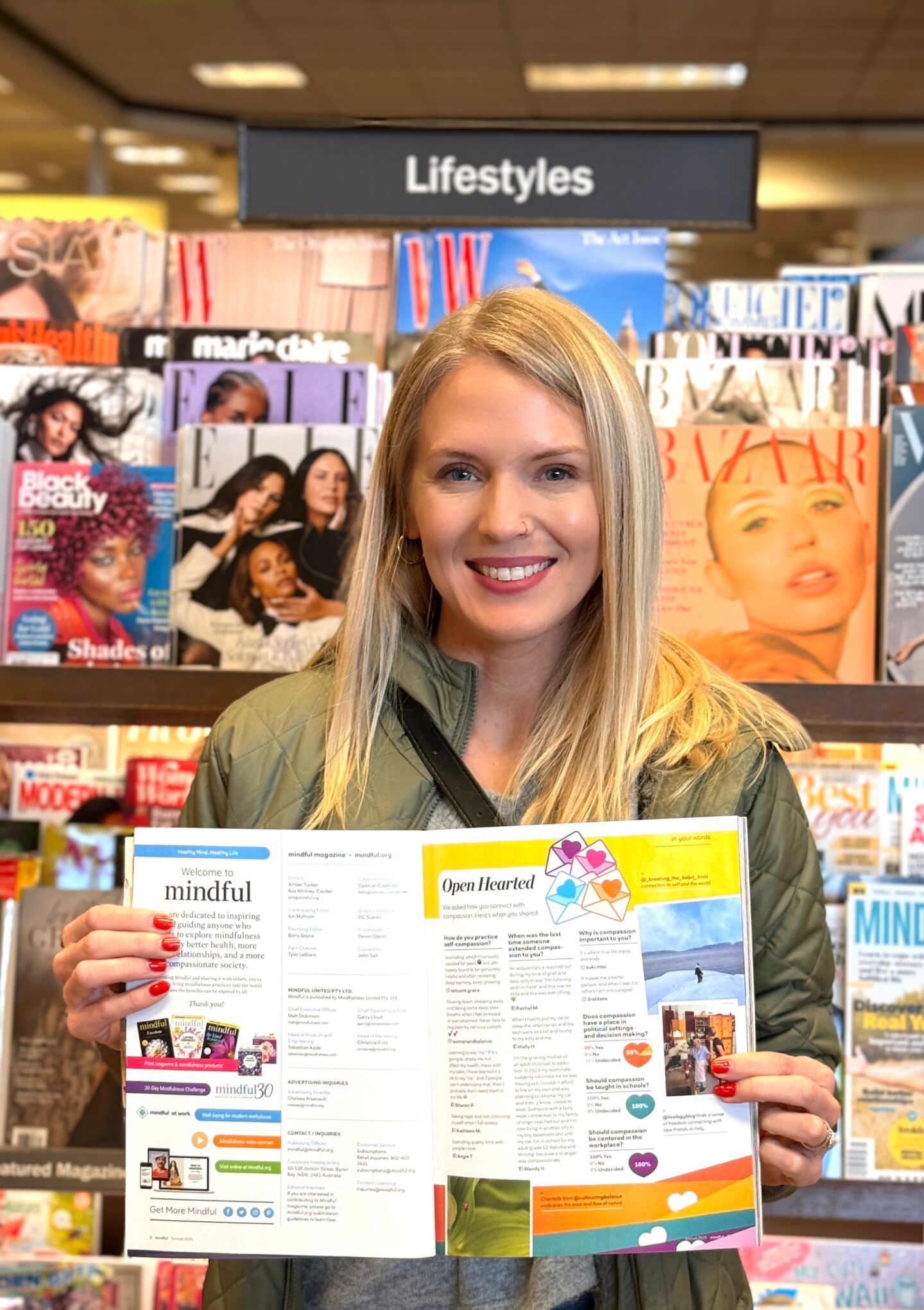 Blonde woman holding open a magazine